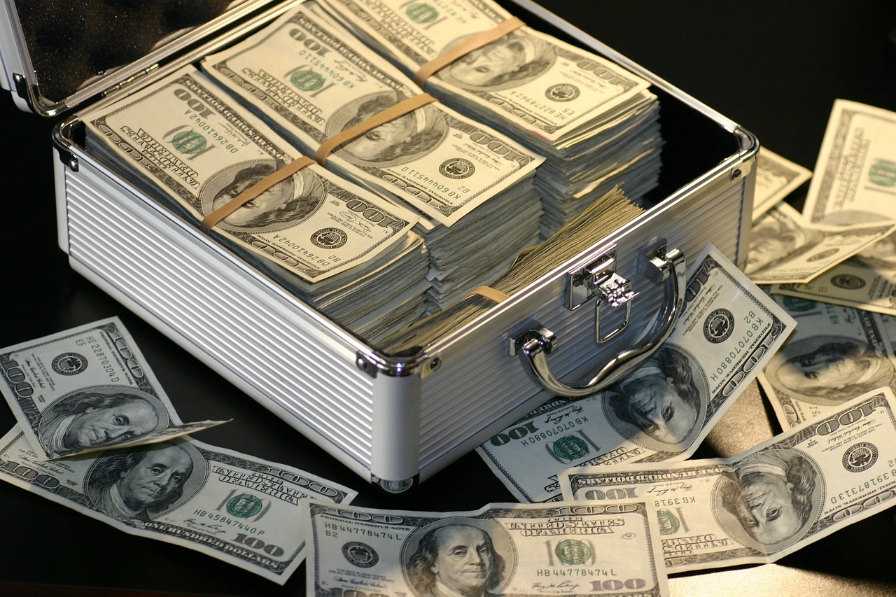 money stacked in brief case