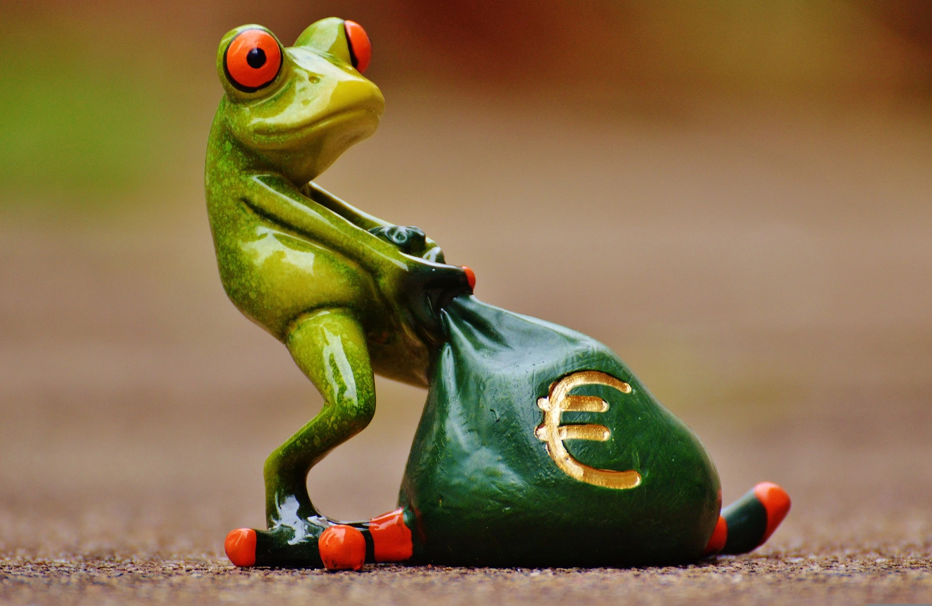 frog pulling a bag