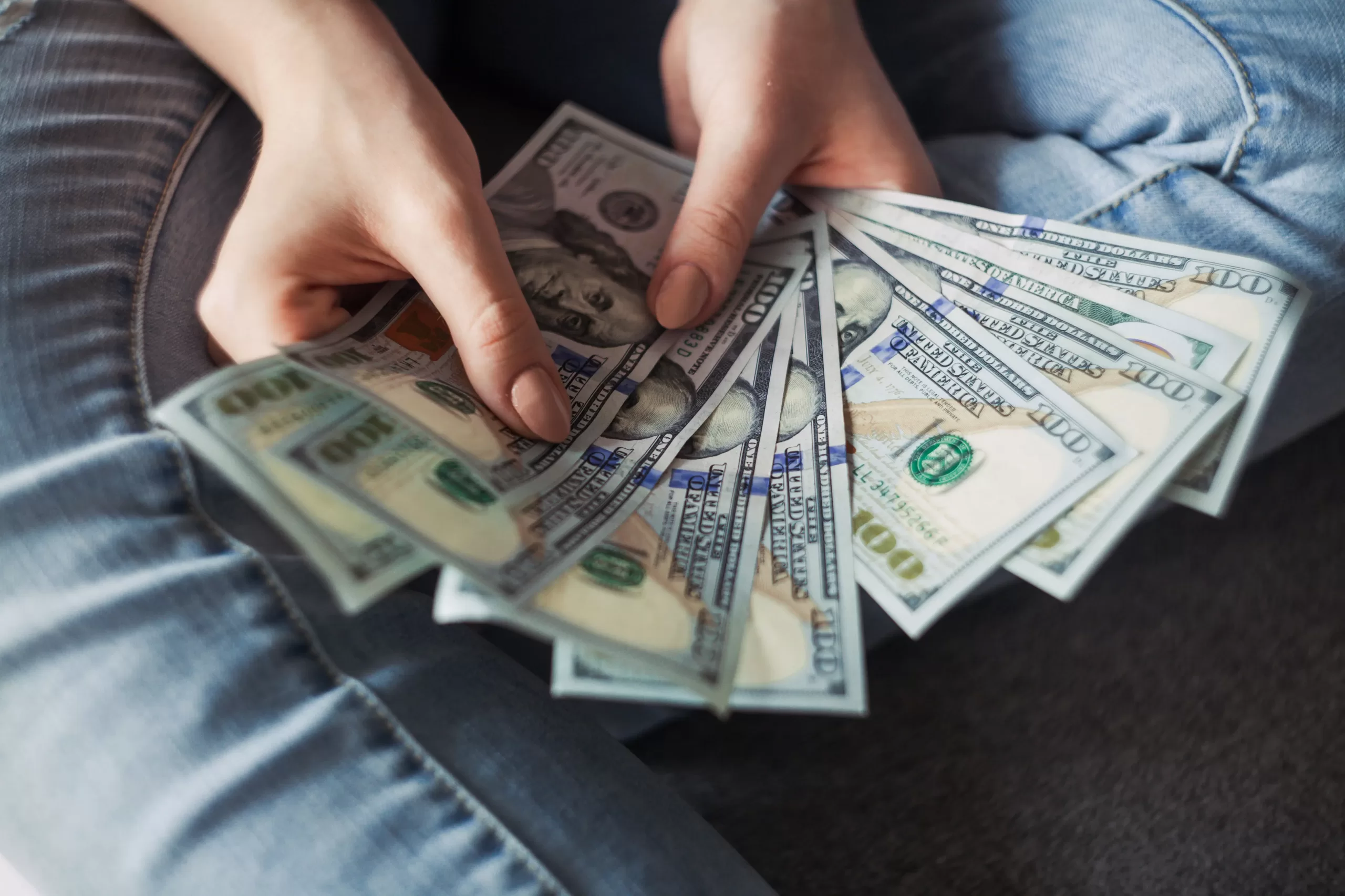 a person with money in their hand