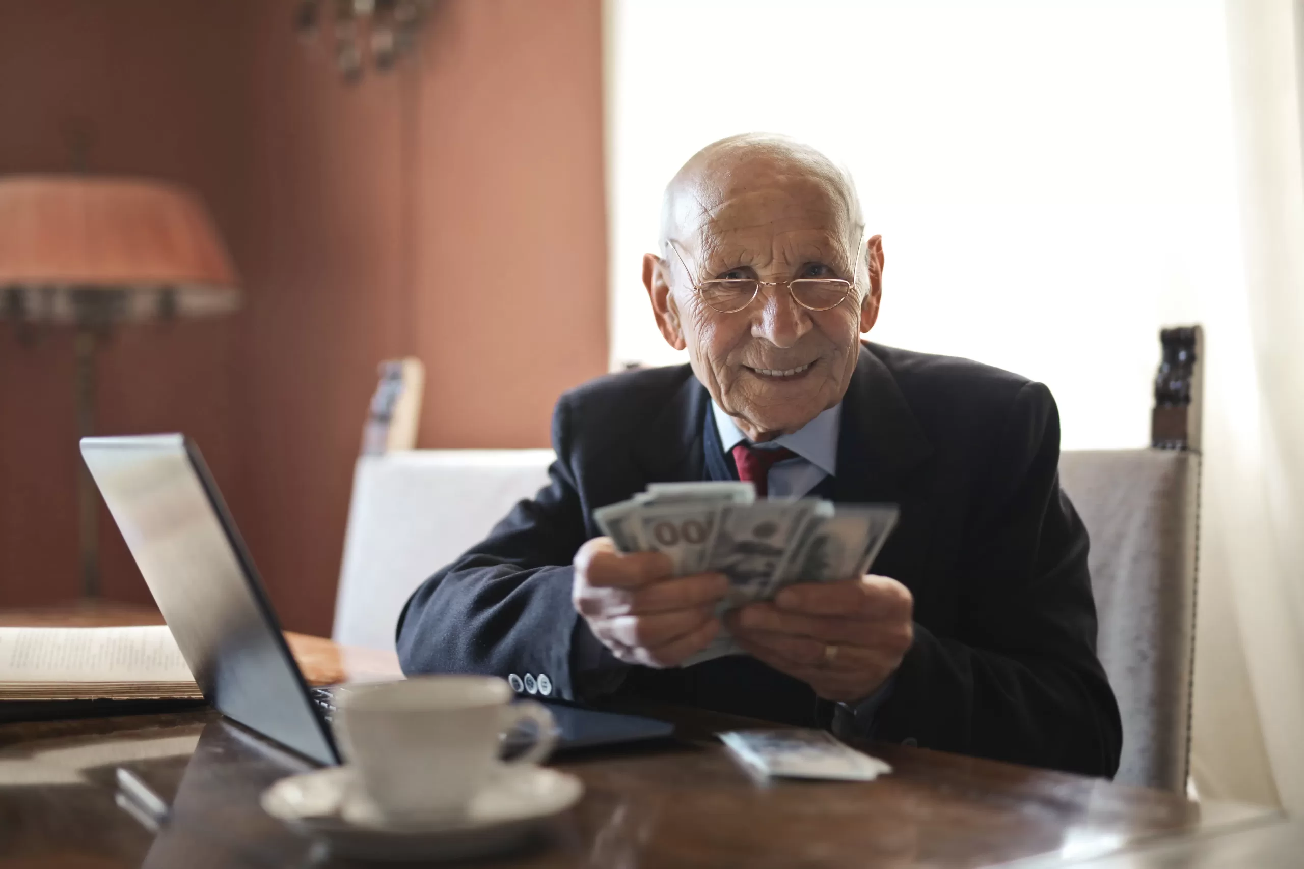 old man with money in his hand