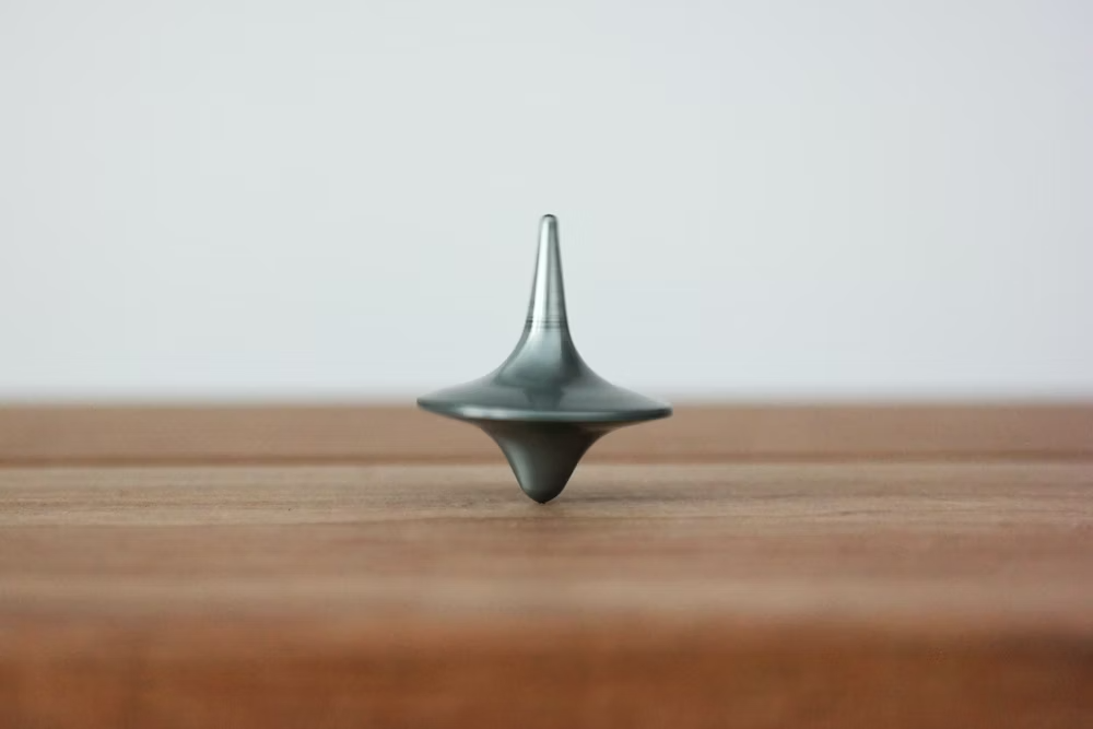 spinning top on a table